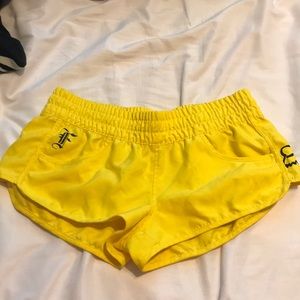 Bright yellow board shorts